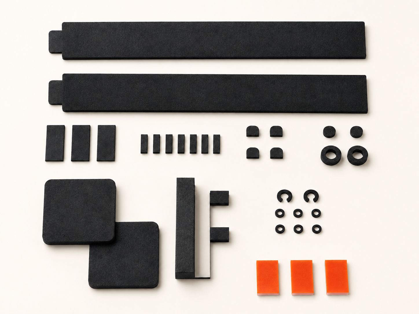 A kit of die-cut foam and rubber parts